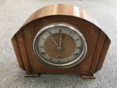 An oak cased mantel clock,