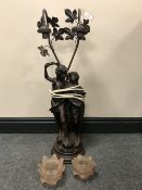 A two way Figural table lamp with glass shades,