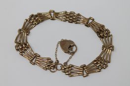 A 9ct gold padlock bracelet, 8.