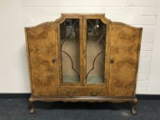 A figured walnut four door display cabinet,