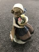 A Lladro figure - girl with flowers