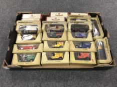 A box containing approximately twenty boxed die cast vehicles,