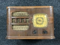 A twentieth century Serenader valve radio fitted with a clock