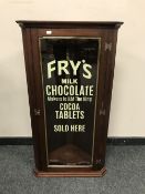 An antique and later mahogany corner cabinet with glazed door 