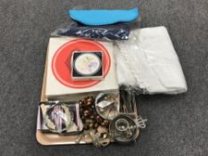 A tray containing table linen, boxed Pimpernel place mats, napkin rings, butter knives,