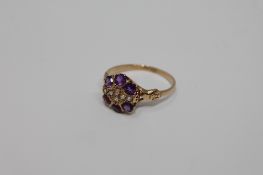 An 18ct gold amethyst diamond cluster ring, size M/N, 1.8g.