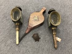 A tray containing a pair of antique brass coach lamps, a set of bellows,