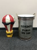 A set of graduated lidded metal canisters together with a metal hot air balloon.