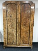 A burr walnut double door wardrobe