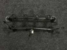 Two cast metal coat racks