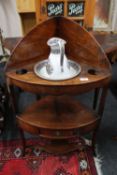 A Georgian mahogany corner washstand together with a china jug and basin