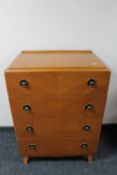 A mid twentieth century four drawer chest