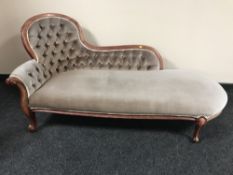 A Victorian style button back chaise longue