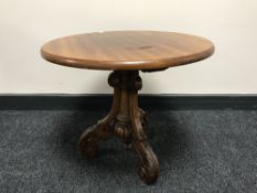 A mahogany pedestal lamp table