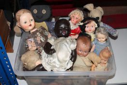 A box containing mid twentieth century dolls