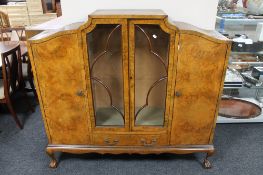 A figured walnut four door display cabinet,