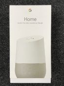 A Google Home Hands free Smart Speaker,