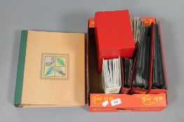 A box containing two albums of first day covers,