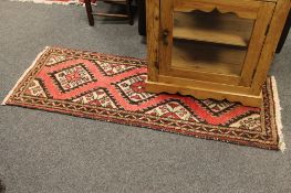 A North West Persian rug on pink ground,