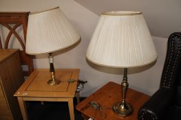 Two brass table lamps with shades