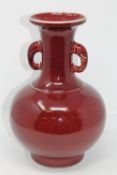 A Chinese Sang de Boeuf baluster vase,