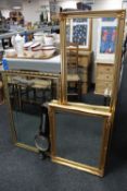 Three gilt framed mirrors,