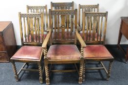 A set of six carved oak barley twist dining chairs comprising two carvers and four singles