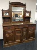 An Edwardian oak mirror back sideboard