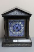 A Victorian ebonised cased mantel clock with blue porcelain dial
