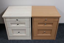 A contemporary three drawer bedside chest in a pine finish,