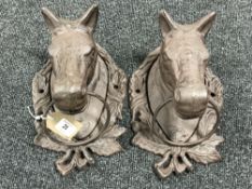 A pair of cast metal horse head tie rings
