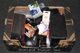 A box containing a quantity of cameras and camera equipment, including Olympus OM110 and OM120,