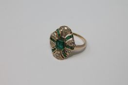 A yellow gold lady's diamond and emerald ring, size T/U.