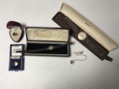 A gents yellow metal Garrard wristwatch in box together with a silver Avia wristwatch,