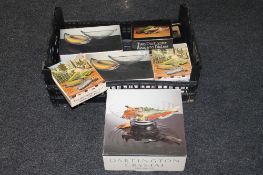 A box containing boxed Dartington crystal including melon boats, avocado dishes, sweet corn dishes,