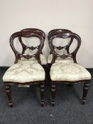 A set of four Victorian style balloon back chairs