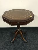 A octagonal mahogany leather topped pedestal occasional table,