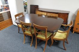 An inlaid mahogany Regency style shaped front sideboard,