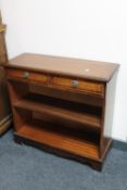 A set of inlaid mahogany open bookshelves,