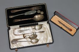 A collection of sterling silver, including a Celtic brooch, a cased baby fork and spoon,