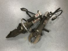 Two Amkus hydraulic cutting tools