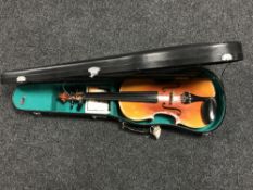 A Chinese violin and bow in hard carry case