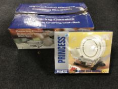 A boxed catering chafing dish and a boxed Princess Classic dish warmer