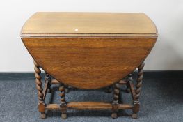 An oak barley twist gate leg table