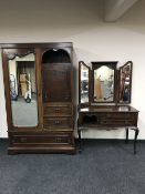 A Victorian mahogany mirror door wardrobe fitted with cupboards and drawers together with a