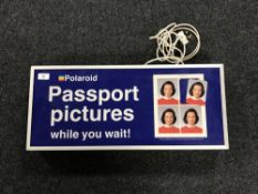 A vintage Polaroid Passport light box