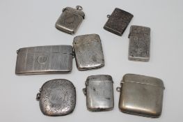 A collection of silver vesta cases and a card case