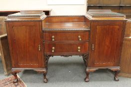A late Victorian mahogany pedestal sideboard, on claw and ball feet,