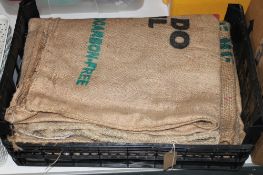 A crate containing seven Hessian coffee sacks