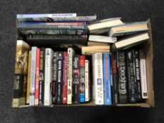 A box and a basket of hard back books relating to NUFC and football autobiographies,
